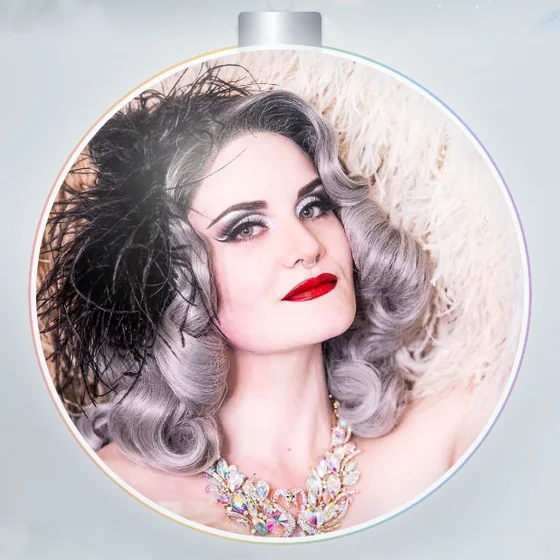 Ms. Nina bel Vande, framed in a silver holiday ornament